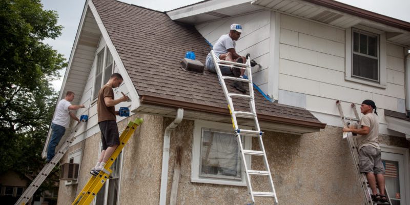 Members of the 934th Airlift Wing volunteer to help out  a homeowner in Minneapolis through the Metro Paint-A-Thon program.  The group has been volunteering since 1988 and has painted and repaired over 21 homes in the metro area over the years. (U.S. Air Force photo/Shannon McKay)